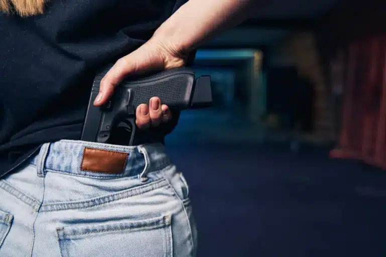 woman hiding her weapon in her jeans 2024 10 22 06 20 51 utc